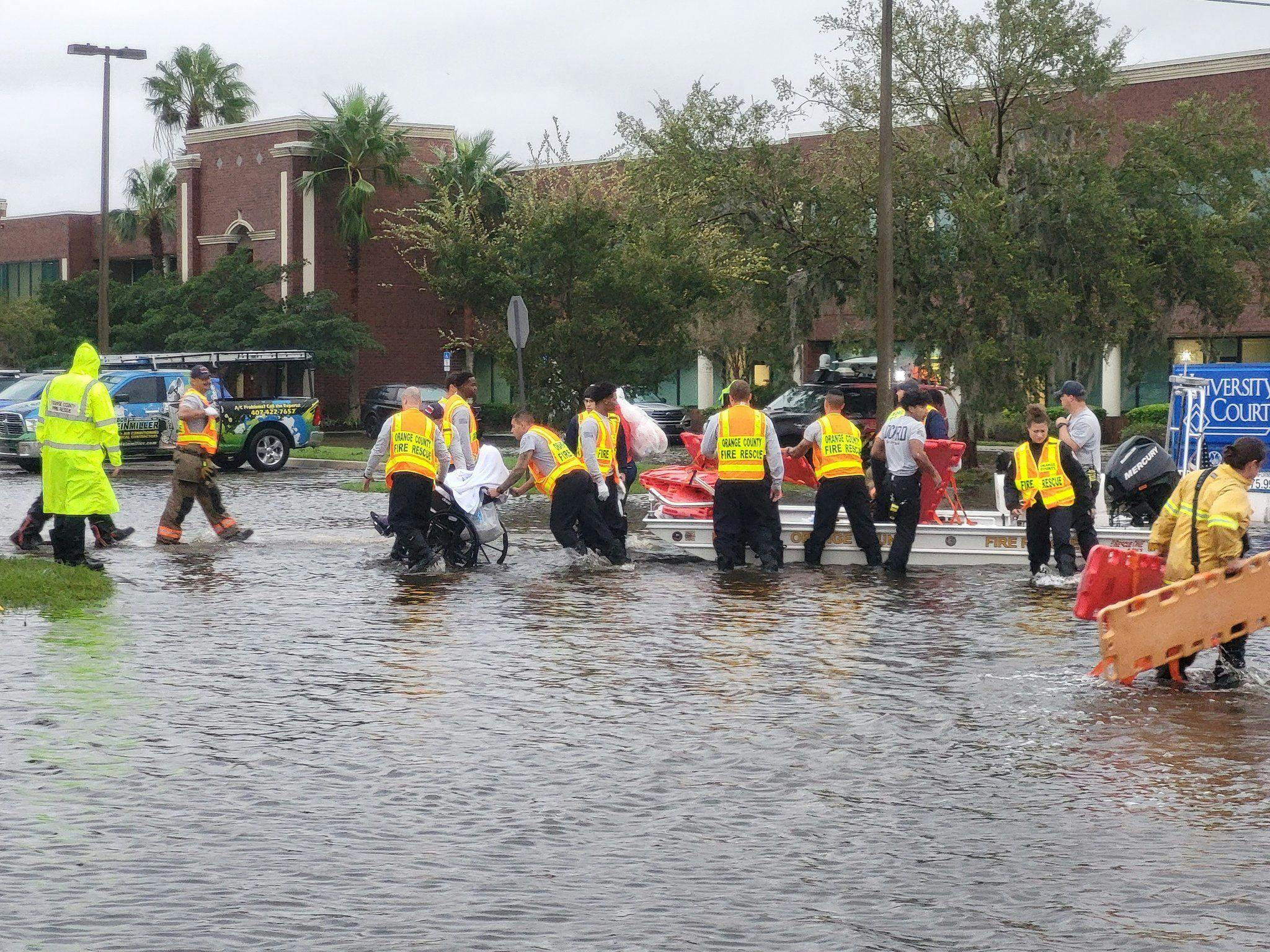Orange County Fire Rescue workers help evacuate residents from an assisted living facility near Orlando Thursday. (Photo by Orange County Fire Rescue)