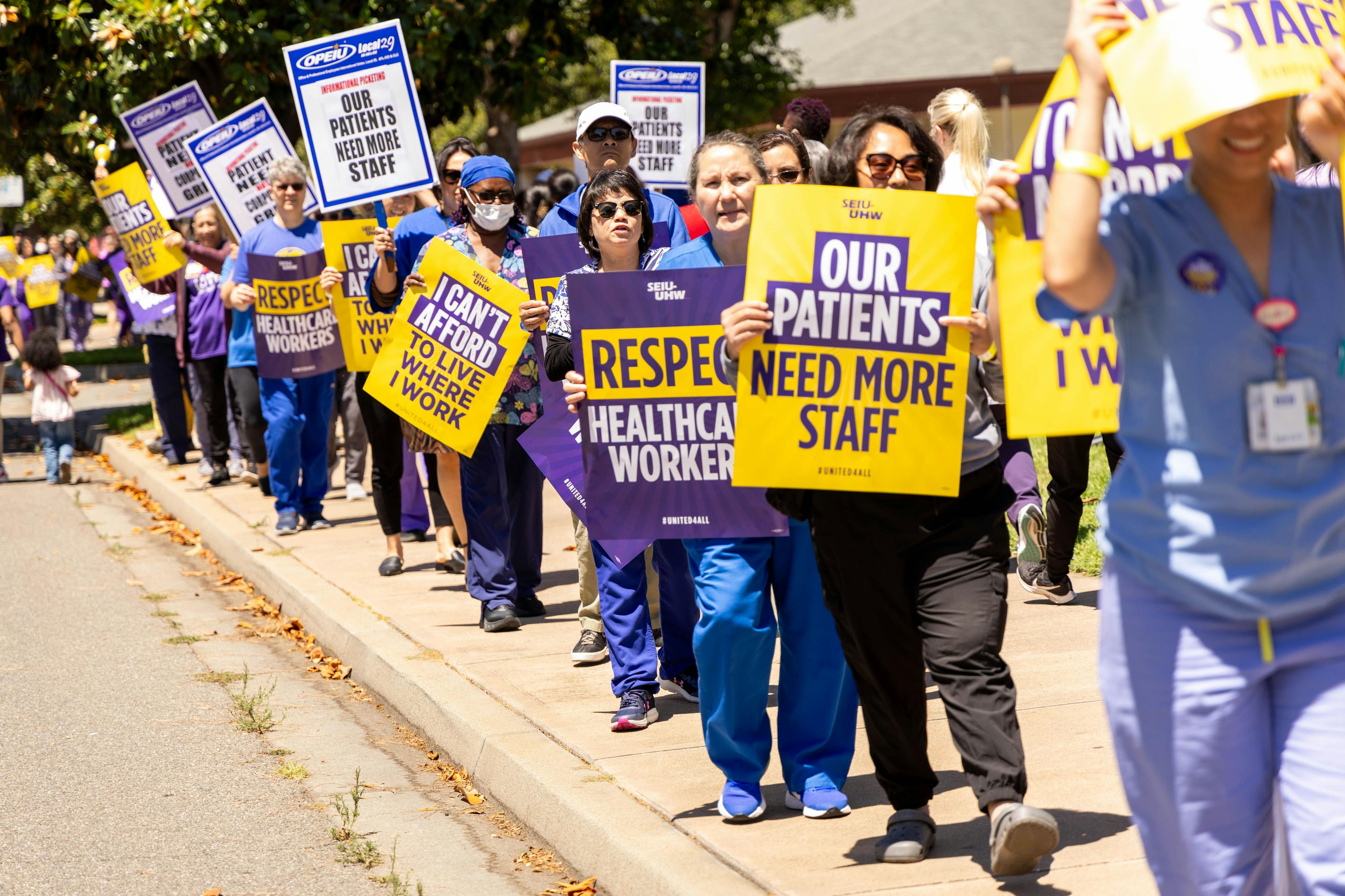 Union workers at Kaiser Permanente have begun a strike. Workers with SEIU-UHW, shown here picketing in July, and other unions say they're seeking better compensation and staffing. (Image: SEIU-UHW)